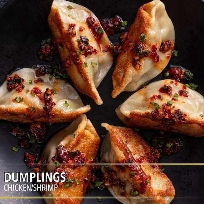 Pan-fried chicken and shrimp dumplings with chilli oil