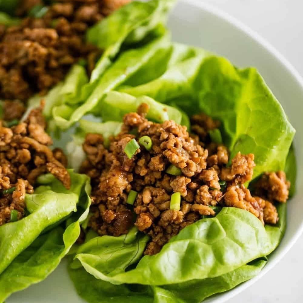 Chicken lettuce cups filled with savoury minced chicken and spring onion